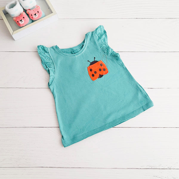 Polera Algodón Verde Marca Next baby 6-9 M Estado Casi tiki