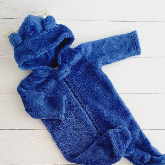 Osito peludo azul con capucha 3 meses Marca All basics Estado Tiki taka
