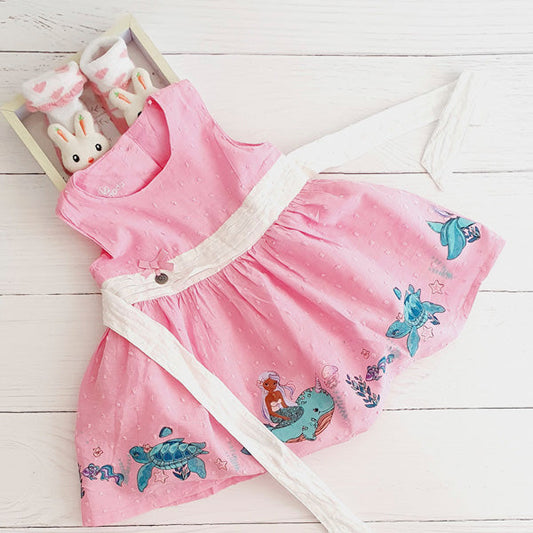 Vestido tela rosada diseño sirenas 9 meses Marca Limonada Estado Tiki taka