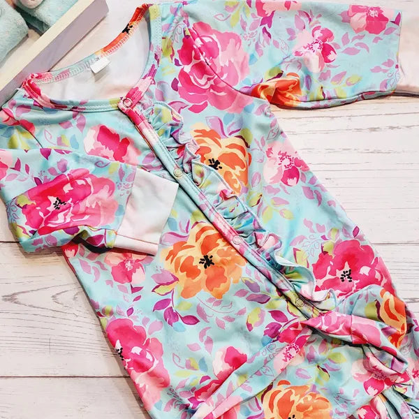 Osito lycra celeste con diseño flores y broches 9 meses Marca Genérica Estado Tiki taka