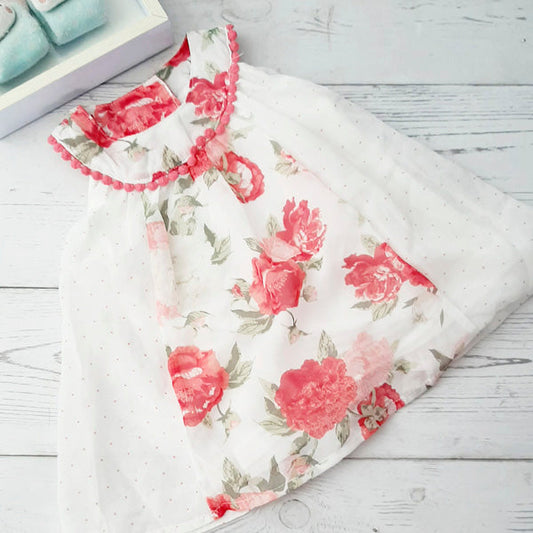 Vestido tela con estampado de flores rosadas y puntos 9 meses Marca Limonada Estado Tiki taka