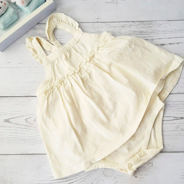 Body vestido tela amarilla 3-6 meses Marca Urb Estado Casi tiki